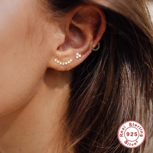 S925 sterling silver gold ear studs set with CZ stones on model ear
