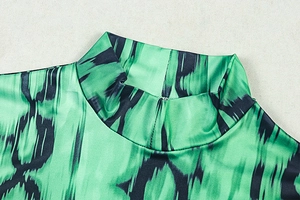 Detailed close-up of high turtleneck and abstract print on silky polyester fabric