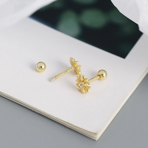 Detailed macro view of golden sunflower s925 silver stud earrings with zircon center