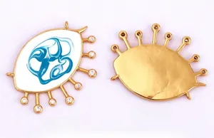 Detailed front and back view of gold-plated heart evil eye pendant with blue enamel