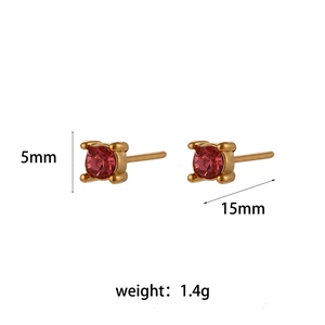 Gold stainless steel stud earrings with 5mm round red zircon stones on a white background