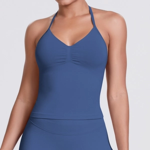 Close-up of blue seamless halter yoga vest featuring a pleated chest design and matte fabric