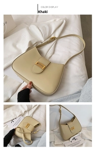 Detail of khaki crescent shoulder bag featuring gold chain link and matte leather finish
