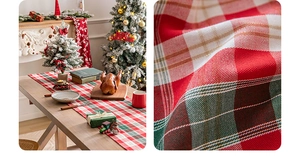 Detailed macro view of woven red and green plaid Christmas table runner texture and finish