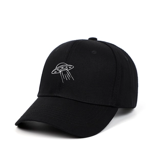 Black cotton baseball cap featuring white UFO spaceship embroidery and curved brim style