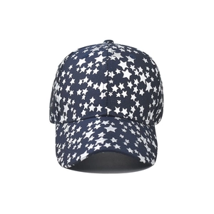Navy blue cotton baseball cap with all-over white star print and structured curved brim