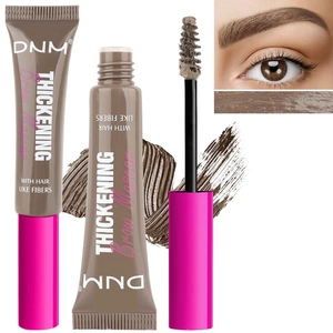 Detailed view of eyebrow mascara wand with fibers and swatches for thickening brows