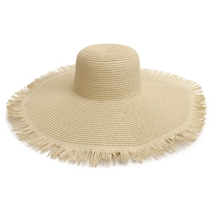 Close-up of wide brim straw beach hat with fringe edge detail and woven texture