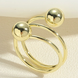 Detailed view of a gold double-layer open ring featuring polished metal beads