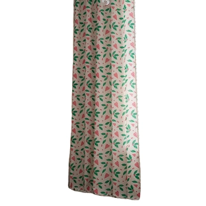 Linen texture Christmas curtain with green holly leaves and red heart patterns
