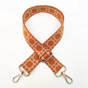 Adjustable caramel shoulder strap with white cannage embroidery and gold metal hardware