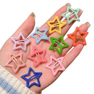Colorful star-shaped hair clips for kids with solid colors and white polka dot patterns