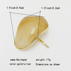 Elegant gold resin hair clip with irregular translucent amber stone and size details