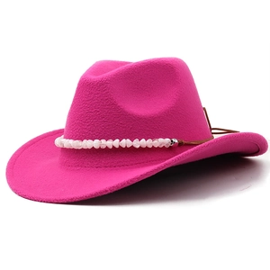 Detail of fuchsia wool western cowboy hat with pink bead trim and brown leather cord decoration