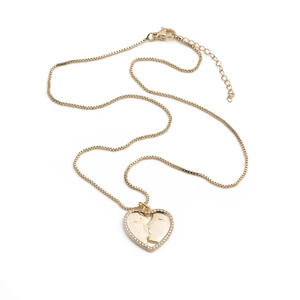 Collier pendentif cœur doré avec profils de baisers et cristaux brillants pour femmes