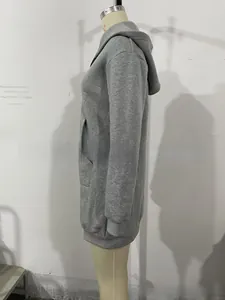 Detail of grey zip-up hoodie featuring ribbed cuffs and side pockets on a mannequin