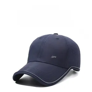 Detail of navy blue sports cap showing honeycomb mesh vents and reflective brim trim