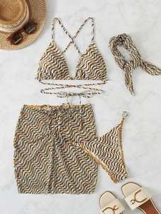 Detail of a four-piece sexy printed bikini set with matching sarong and headscarf