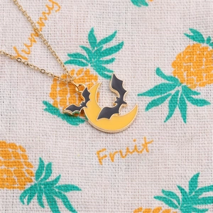 Halloween moon and bat necklace with golden chain and yellow enamel on pineapple fabric