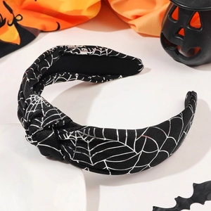 Detail of black knotted headband with silver spider web print for Halloween costume