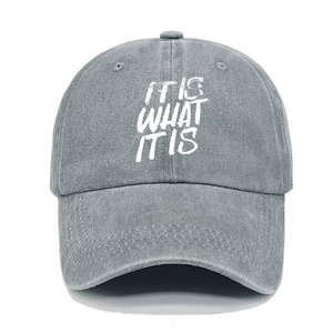 Detailed shot of 'IT IS WHAT IT IS' embroidery on washed cotton vintage baseball cap