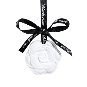 Camellia-shaped white plaster aromatherapy tablet with black ribbon for wardrobe scent