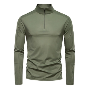 Detail of the half-zip stand collar and olive green sun protection fabric on the shirt