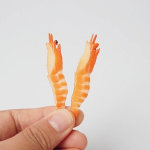 Realistic PVC mini shrimp food models for DIY crafts, set of two shown in hand