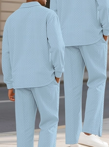 Detail view of light blue polo set featuring a distinct diamond jacquard waffle texture