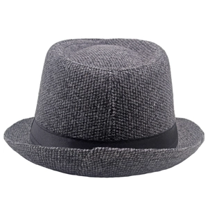 Close-up of grey wool fedora hat showing thick knitted texture and black decorative band