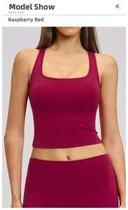 Detail of raspberry red racerback sports vest and yoga leggings in matte finish
