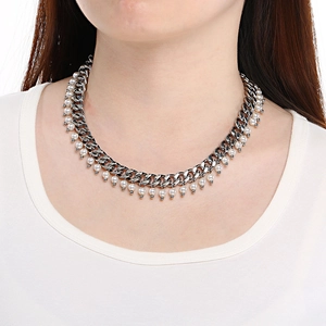 Elegant 9mm silver Cuban chain necklace with white pearl pendants worn by a model