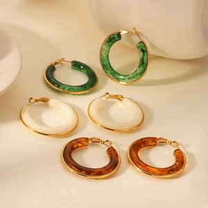 French vintage resin hoop earrings in dark green, ivory white, and amber brown colors