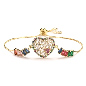 Adjustable gold heart bracelet with colorful micro-pave cubic zirconia on white background