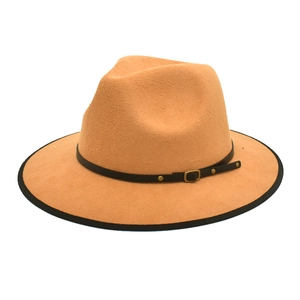 Close-up of camel wool fedora hat with black leather strap and gold metal buckle