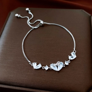 Detailed view of silver heart zircon bracelet with adjustable sliding box chain