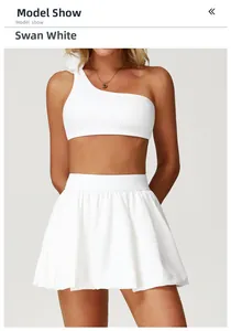Detail view of Swan White high-waisted pleated tennis skirt with textured performance fabric