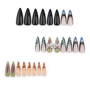 Stiletto press-on nails set with black solid colors, leopard prints, and butterfly charms
