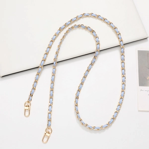 Detail of light blue leather woven with gold metal chain strap and lobster clasps