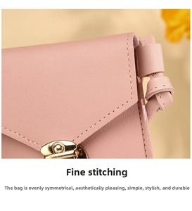 Close-up of pink crossbody phone bag featuring precise stitching and gold metal buckle