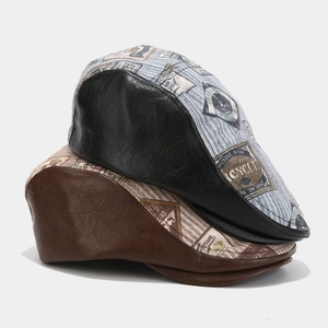 Detail of vintage PU leather patchwork flat caps with cycle shop printed badges
