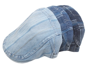Detailed texture of striped denim flat caps in three shades of washed blue