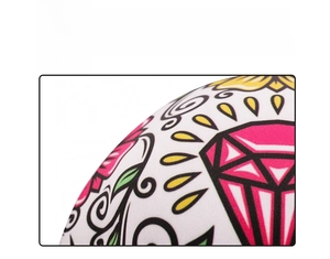 Close-up of Halloween skull mask fabric featuring pink diamond and floral sublimation print