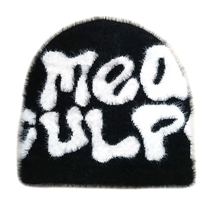 Detail of black knit beanie featuring white fuzzy MEA CULPA letters with plush texture