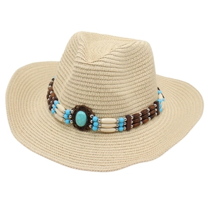 Beige straw cowboy hat with ethnic turquoise stone band and wooden beads on white background