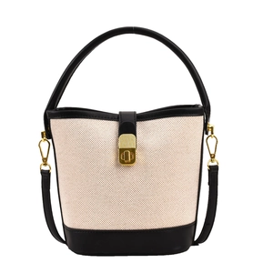Retro canvas and black leather bucket bag with gold buckle and adjustable strap