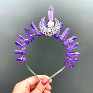 Close-up of purple crystal stone headband with filigree moon and pearl detail