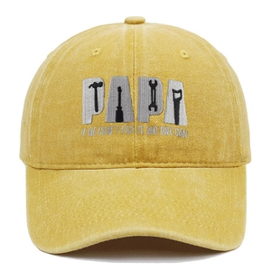 Detailed view of yellow washed cotton baseball cap with PAPA embroidery and tools