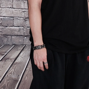 Men's vintage silver Cuban chain bracelet and ring featuring a skull and anchor motif