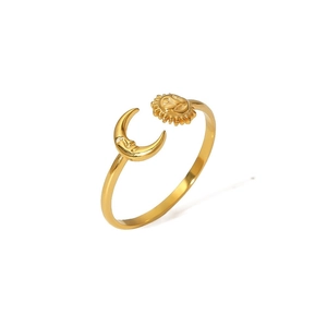 Detailed view of adjustable gold ring featuring vintage sun and moon celestial designs